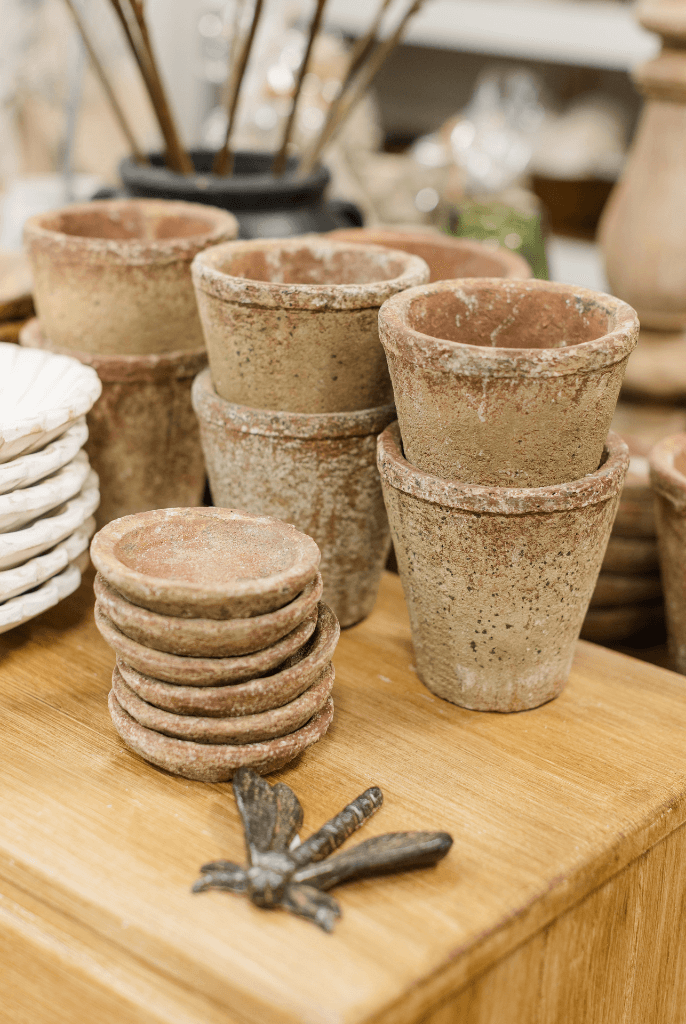 A group of clay pots sitting on a table.